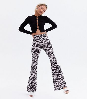 Click to view product details and reviews for Love Yourself Petite Black Logo Flared Trousers New Look.