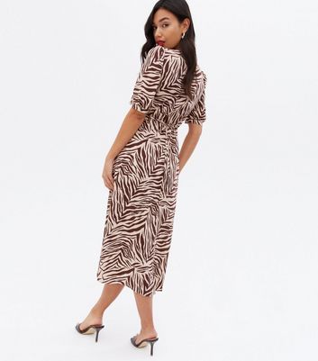 Click to view product details and reviews for Brown Zebra Print Sweetheart Midi Dress New Look.