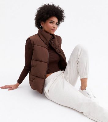 Click to view product details and reviews for Brown Crop High Neck Boxy Gilet New Look.