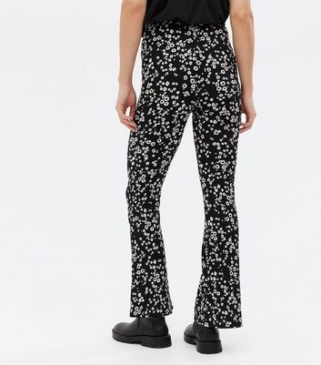 Click to view product details and reviews for Maternity Black Floral Jersey Flared Over Bump Trousers New Look.