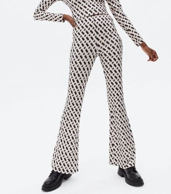 Click to view product details and reviews for Cameo Rose Black Geometric Flared Trousers New Look.