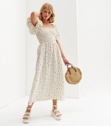 Click to view product details and reviews for White Ditsy Floral Linen Look Shirred Midi Dress New Look.