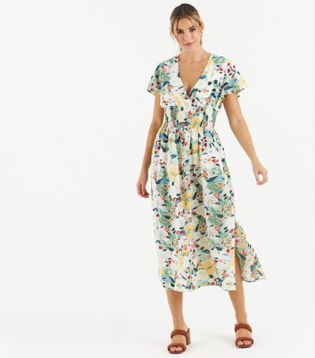 Click to view product details and reviews for Zibi London Green Floral Shirred Midi Wrap Dress New Look.