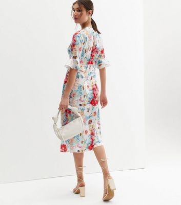 Click to view product details and reviews for Zibi London White Floral Satin Midi Wrap Dress New Look.