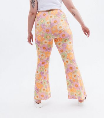 Click to view product details and reviews for Sunflower Power Curves Orange Floral Flared Trousers New Look.