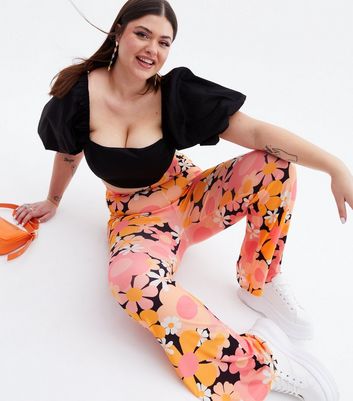 Click to view product details and reviews for Psychedelic Curves Orange Floral Flared Trousers New Look.