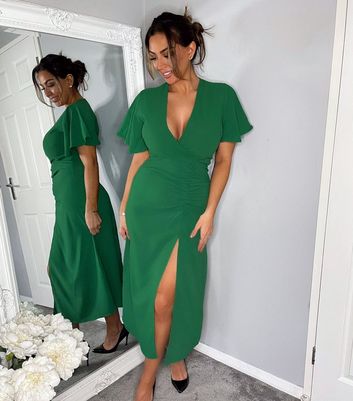 Click to view product details and reviews for Ax Paris Green Ruched Midi Wrap Dress New Look.