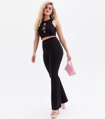 https://media2.newlookassets.com/i/newlook/825042701/womens/clothing/trousers/all-in-love-is-flare-black-flared-trousers.jpg