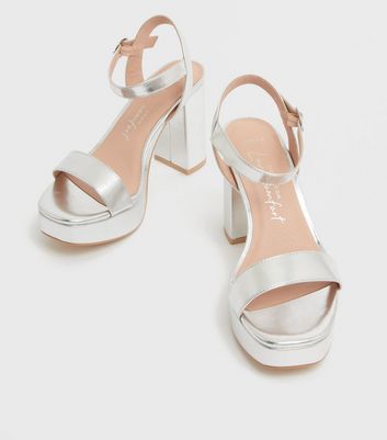 silver and white platform sandals