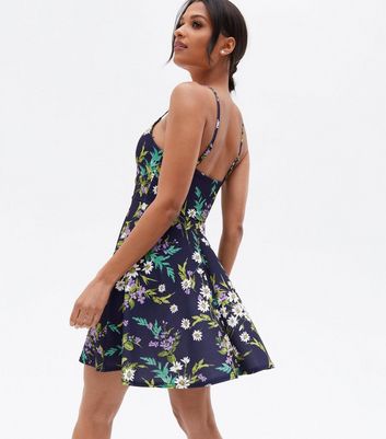 Click to view product details and reviews for Navy Floral Scuba Strappy Mini Skater Dress New Look.
