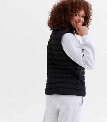 Click to view product details and reviews for Black Padded Lightweight High Neck Gilet New Look.