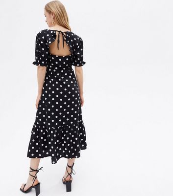 Click to view product details and reviews for Black Spot Open Back Midi Wrap Dress New Look.