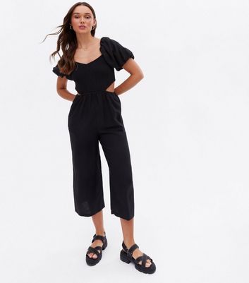 black jumpsuit with cutout sides