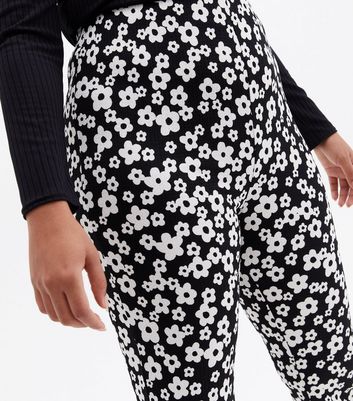 Click to view product details and reviews for Curves Black Floral Crinkle Jersey Flared Trousers New Look.