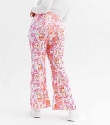 Click to view product details and reviews for Curves Orange Floral Swirl Ribbed Flared Trousers New Look.