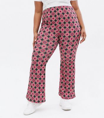 Click to view product details and reviews for Curves Black Geometric Floral Flared Trousers New Look.