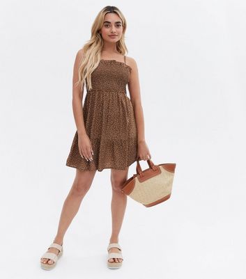 Click to view product details and reviews for Petite Brown Spot Crepe Shirred Mini Dress New Look.