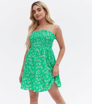 Click to view product details and reviews for Petite Green Daisy Crepe Shirred Mini Dress New Look.