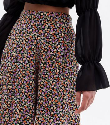Click to view product details and reviews for Black Ditsy Floral Wide Leg Crop Trousers New Look.