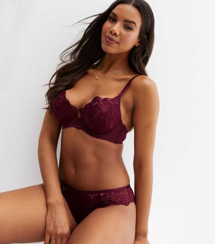 Burgundy lace bra in female hand. Fashion concept Stock Photo by ©SomeMeans  179718030
