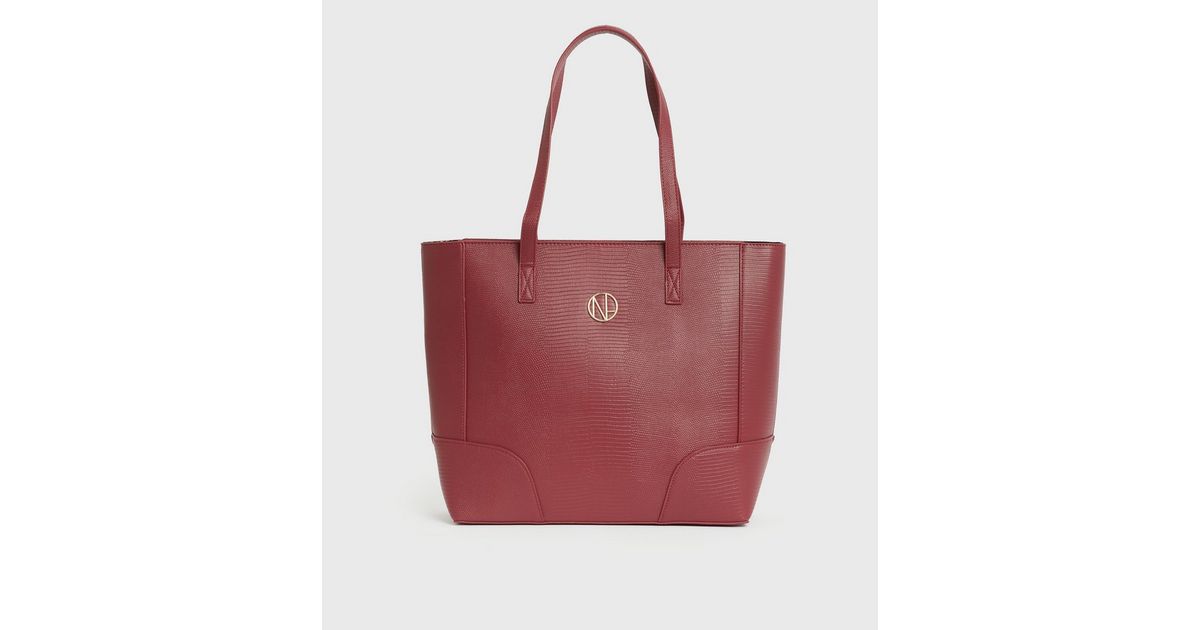 Flip Medium
Red Logo Embossed Leather Tote Bag main image 1