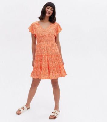 Click to view product details and reviews for Blue Vanilla Bright Orange Ditsy Floral Shirred Tiered Mini Dress New Look.