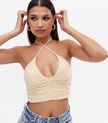 Click to view product details and reviews for Pink Vanilla Off White Ruched Crop Halter Top New Look.