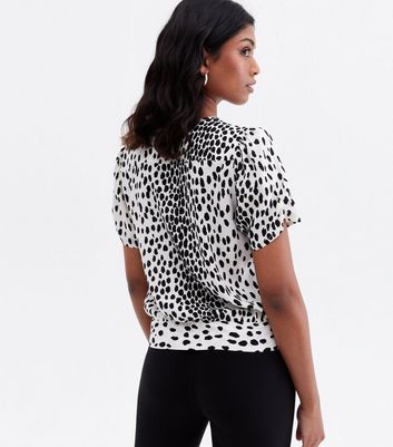 Click to view product details and reviews for White Animal Print Wrap Blouse New Look.