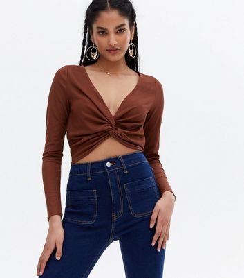 Click to view product details and reviews for Dark Brown Ribbed Knot Front Long Sleeve Crop Top New Look.