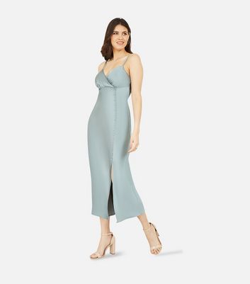 Click to view product details and reviews for Mela Light Green Satin Button Midi Slip Dress New Look.