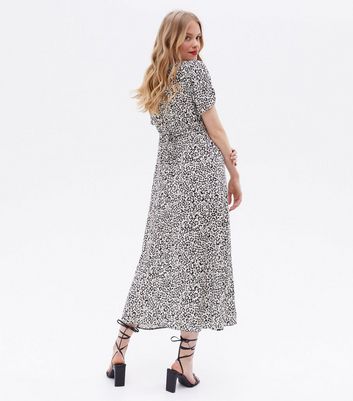 Click to view product details and reviews for Black Floral Tie Back Button Front Midi Dress New Look.