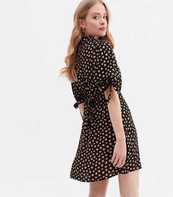 Click to view product details and reviews for Black Ditsy Floral Tie Sleeve Mini Shirt Dress New Look.