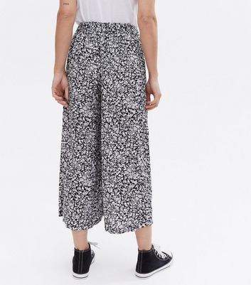 Click to view product details and reviews for Maternity Black Ditsy Floral Over Bump Wide Leg Crop Trousers New Look.