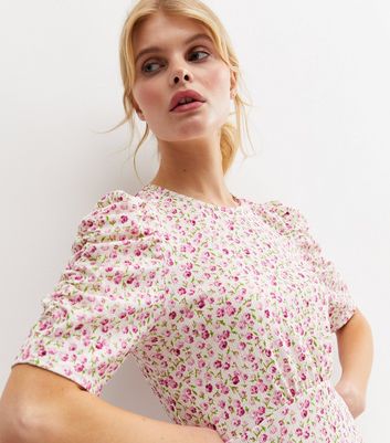 Click to view product details and reviews for Pink Ditsy Floral Ruched Sleeve Mini Dress New Look.