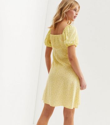 Click to view product details and reviews for Yellow Ditsy Floral Puff Sleeve Sweetheart Mini Dress New Look.