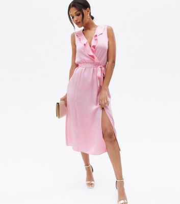 Click to view product details and reviews for Pale Pink Satin Sleeveless Ruffle Midi Wrap Dress New Look.