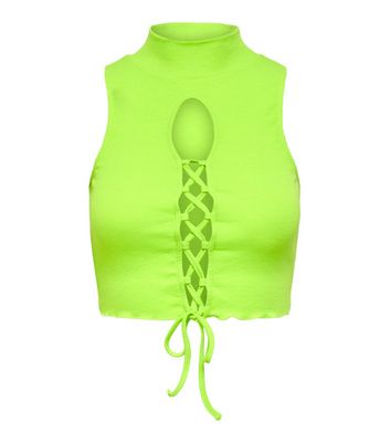 Click to view product details and reviews for Neon Nylon Green Lace Up Crop Top New Look.