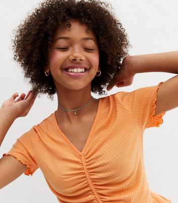 orange peplum top