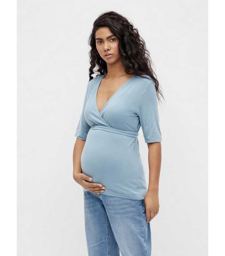 https://media2.newlookassets.com/i/newlook/836144045/womens/clothing/tops/mamalicious-maternity-pale-blue-wrap-nursing-top.jpg?strip=true&qlt=50&w=720