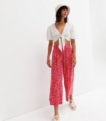 red animal print wide leg crop trousers