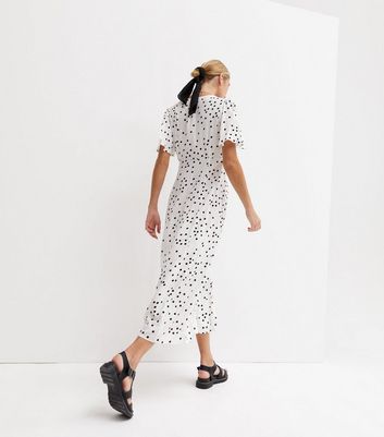 White dress with store spots