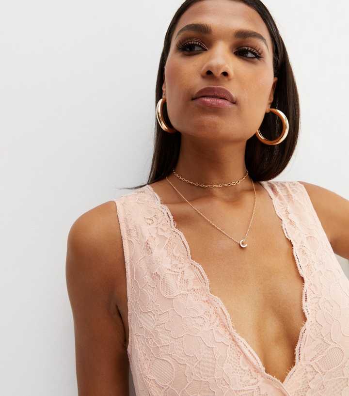 ASOS DESIGN cut out bodysuit in pink lace