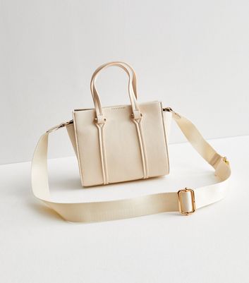 Cream handbags top