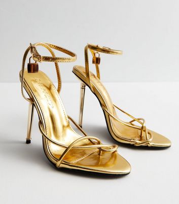 ASOS DESIGN Wide Fit Nifty tie leg heeled sandals in gold | ASOS