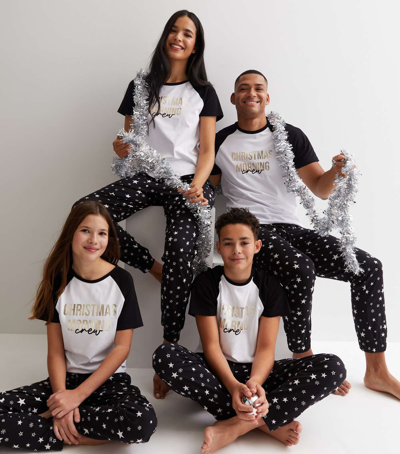 Girls Black Family Christmas Jogger Pyjama Set with Star Print Image 2