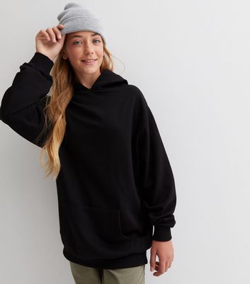 Girl in shop black hoodie