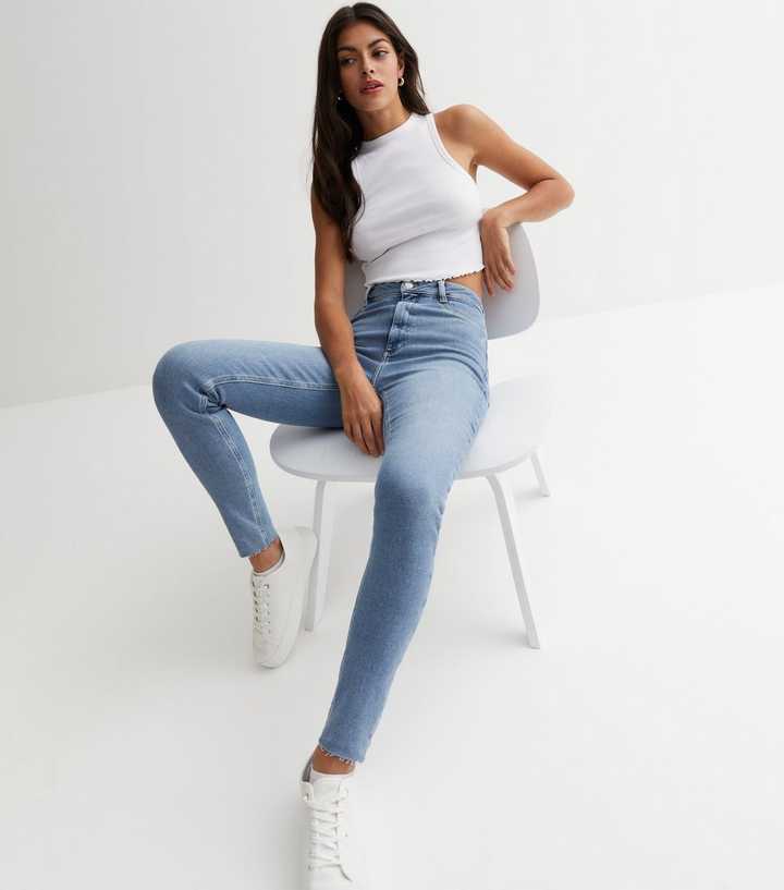 https://media2.newlookassets.com/i/newlook/847387540/womens/clothing/jeans/blue-frayed-hem-high-waist-hallie-super-skinny-jeans.jpg?strip=true&qlt=50&w=720