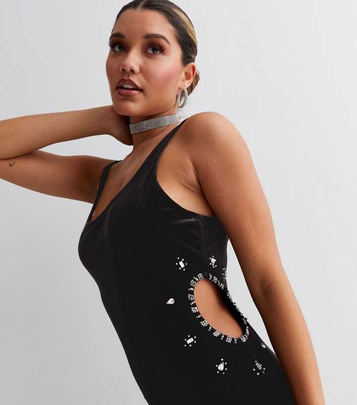 Make a statement in the Stretch Velvet Cut Out Bodysuit. Shop now