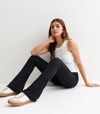https://media2.newlookassets.com/i/newlook/851393101/girls/clothing/basics/girls-black-ribbed-high-waist-flared-trousers.jpg