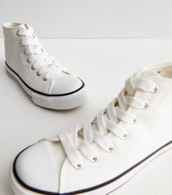 All white canvas store sneakers